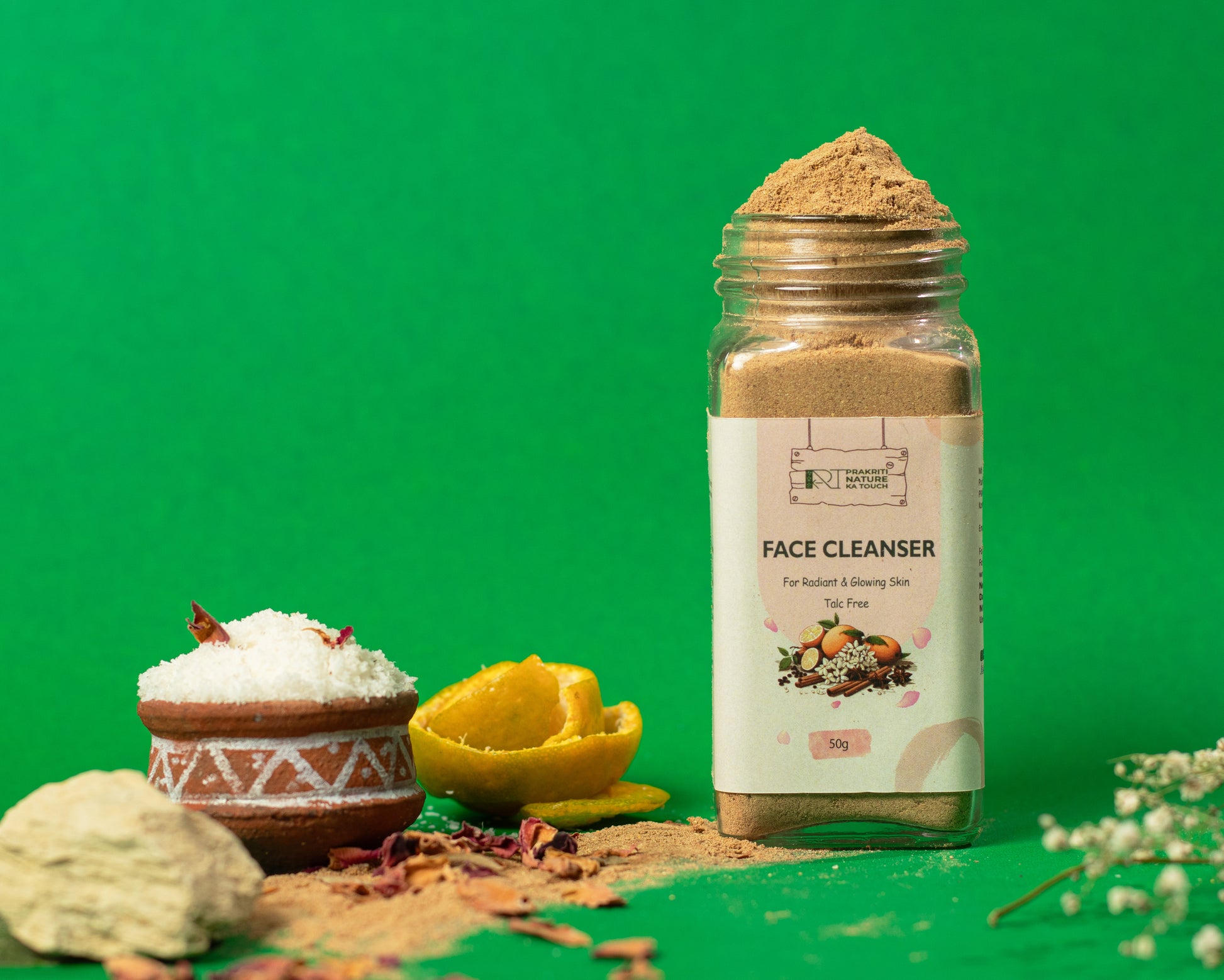 PNKT Herbal Face Brightening Cleanser - Lifestyle shot showing product with fresh orange peels and rose petals - Spa-like natural skincare