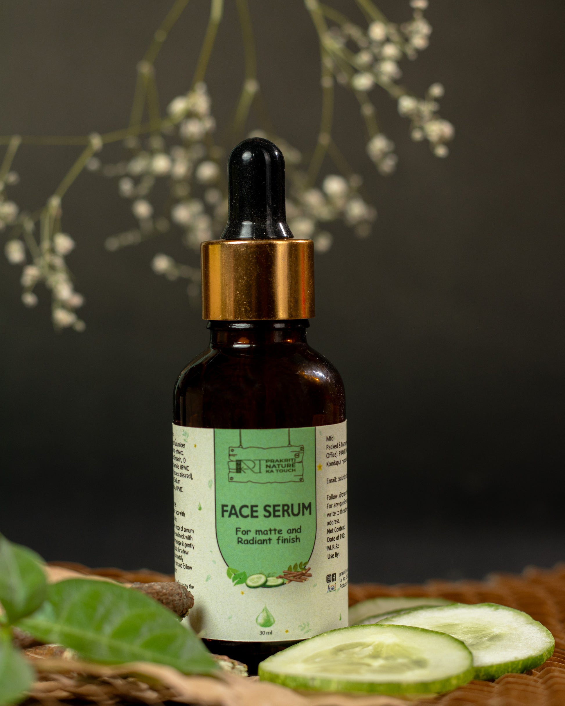 PNKT Natural Face Serum - Lifestyle shot showing serum bottle surrounded by fresh tea tree leaves and cucumber - Natural skincare routine