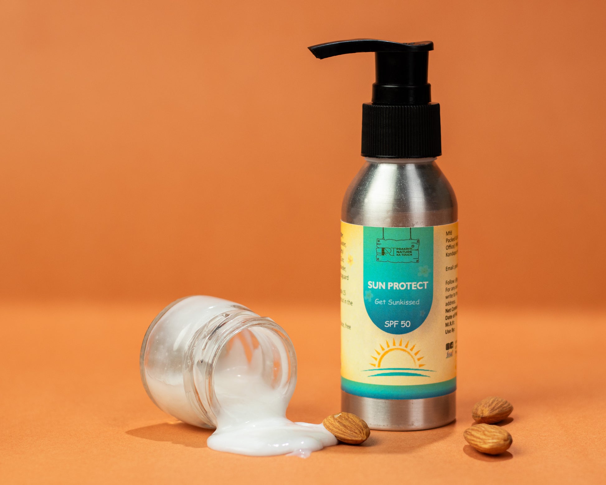 
PNKT Natural Sunscreen Cream - SPF 50 tube on orange background - Broad spectrum UV protection